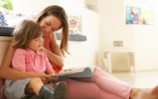 How to Navigate Your Parental Rights & Responsibilities Case in Maine, portrayed by a mother holding her daughter reading a book