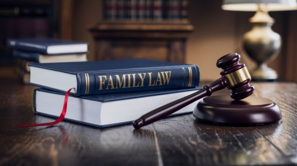 Maine Family Lawyers in Southern Maine located in Portland, Kennebunk, & Brunswick portrayed by family law text next to a gavel on a dark wood table